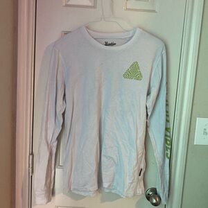 White long sleeve shirt with green "good vibes" on it